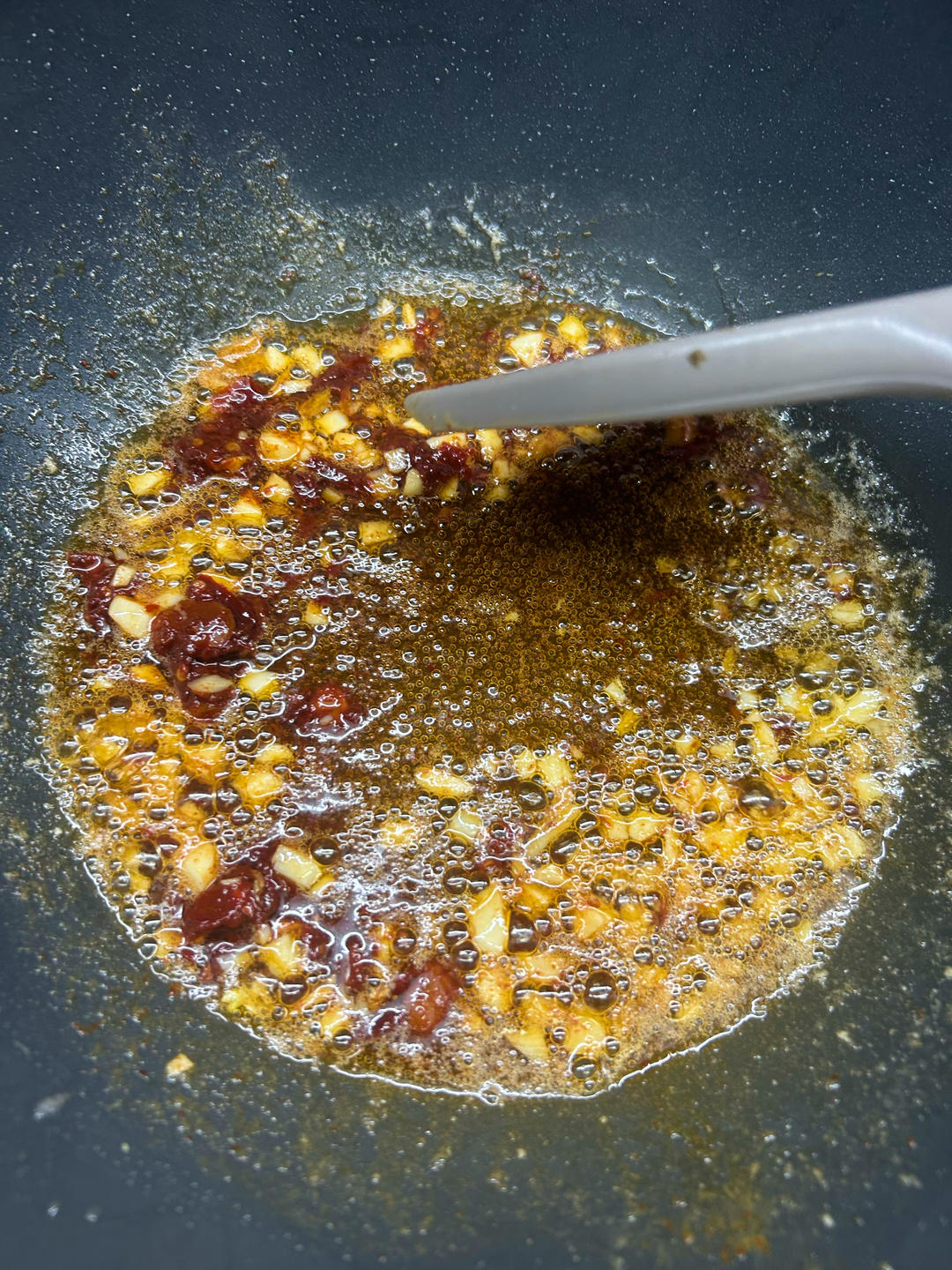 Cook until fragrant and the red oil comes out