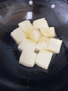 Cut the tofu into pieces and pan-fry it