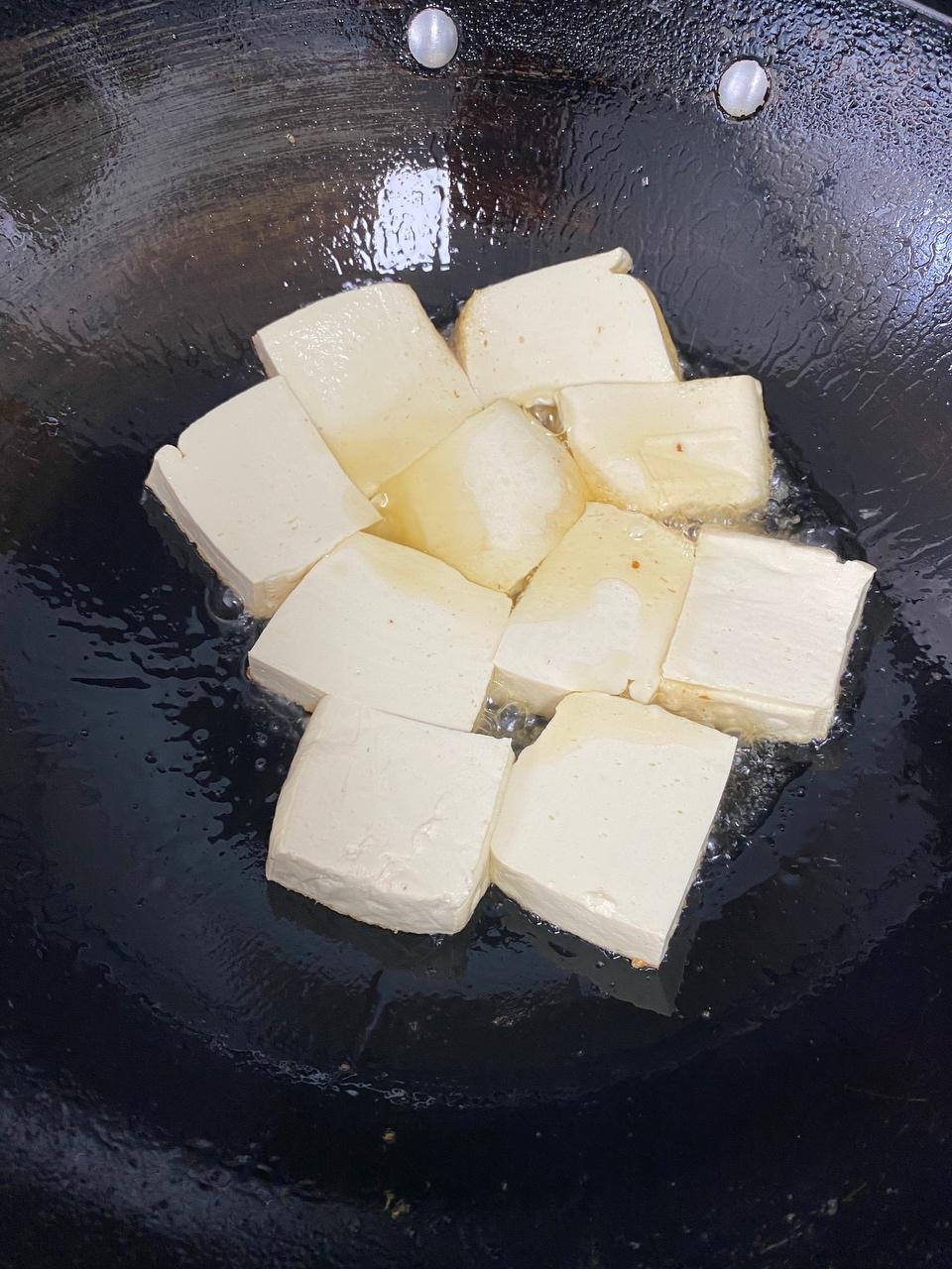Cut the tofu into pieces and pan-fry it
