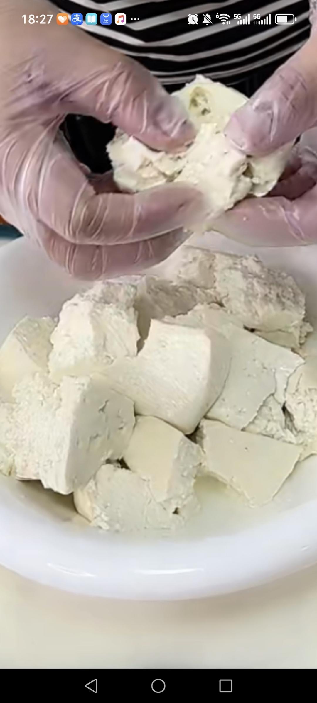 Tear the firm tofu into pieces by hand