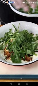 Add the chili rings, scallion, and cilantro