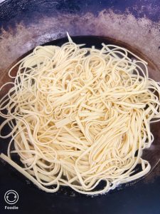 Scald the tofu shreds in boiling water with a