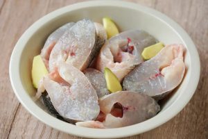 Marinate the sea bass sections