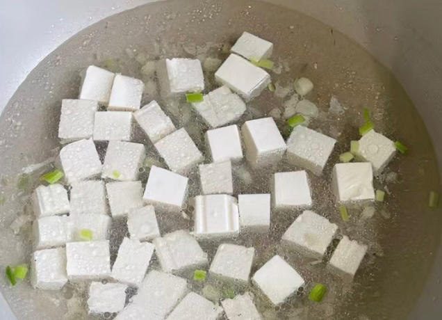 Cut the tofu into cubes and add two bowls of