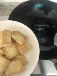 Lift the tofu out, leaving the oil