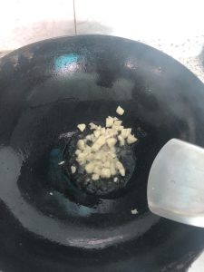 Bloom the garlic in the oil