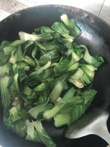 Add the Shanghai greens and toss 15 seconds