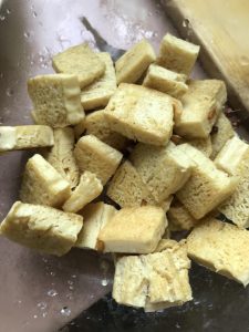 Pan-fry the tofu until golden on both sides,