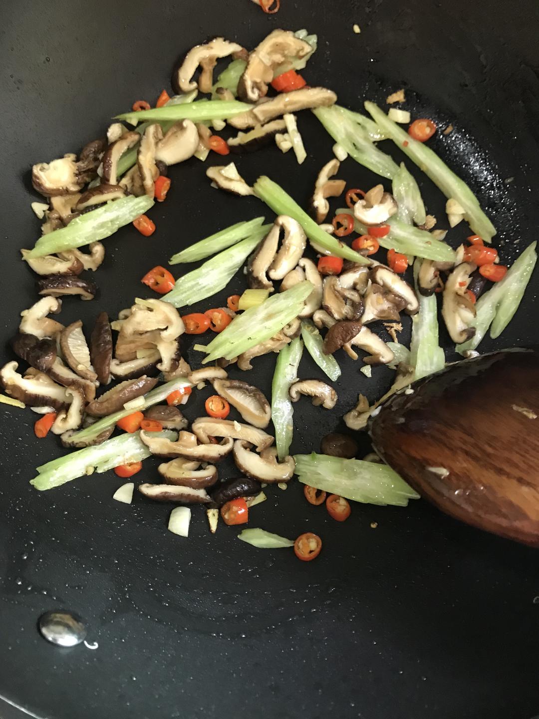 Heat oil and toss the ginger, garlic, and shi
