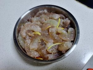 Shell the fresh shrimp by hand - it is the ha