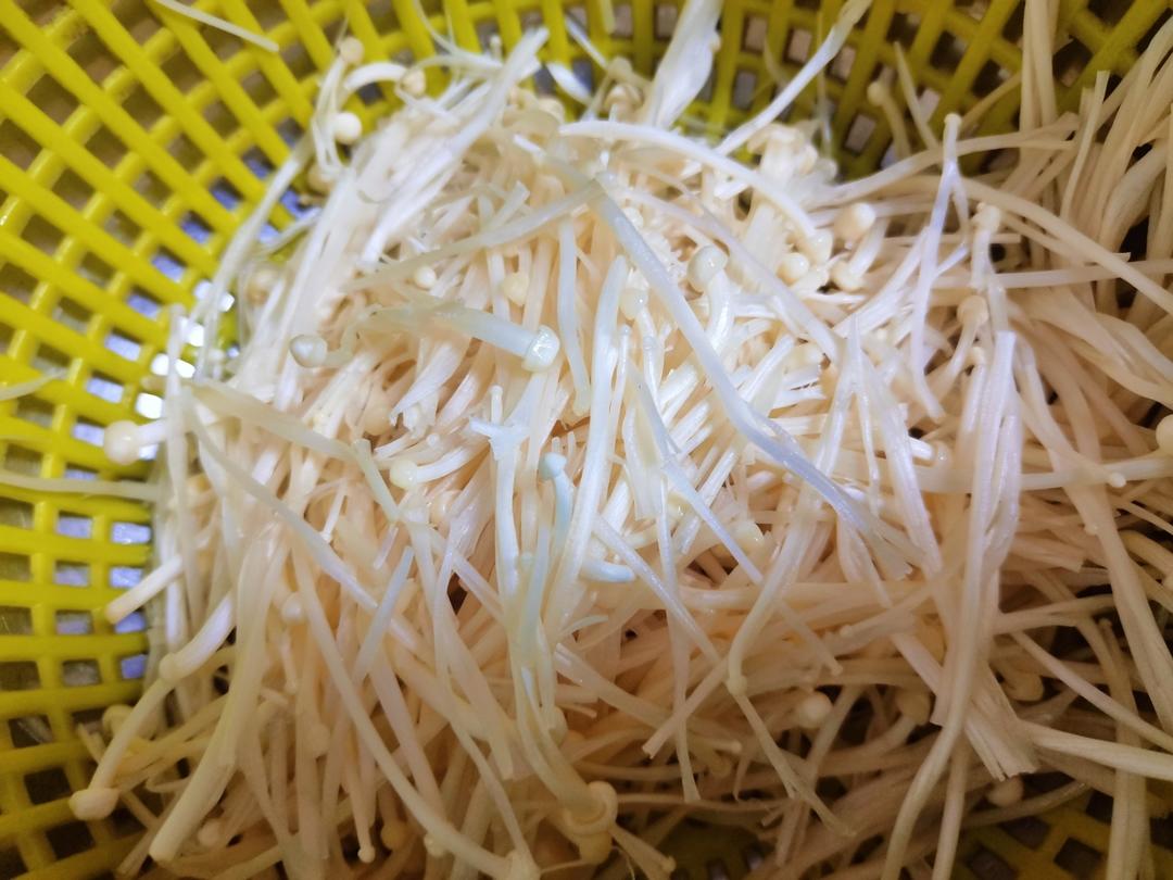 Rinse the enoki mushrooms