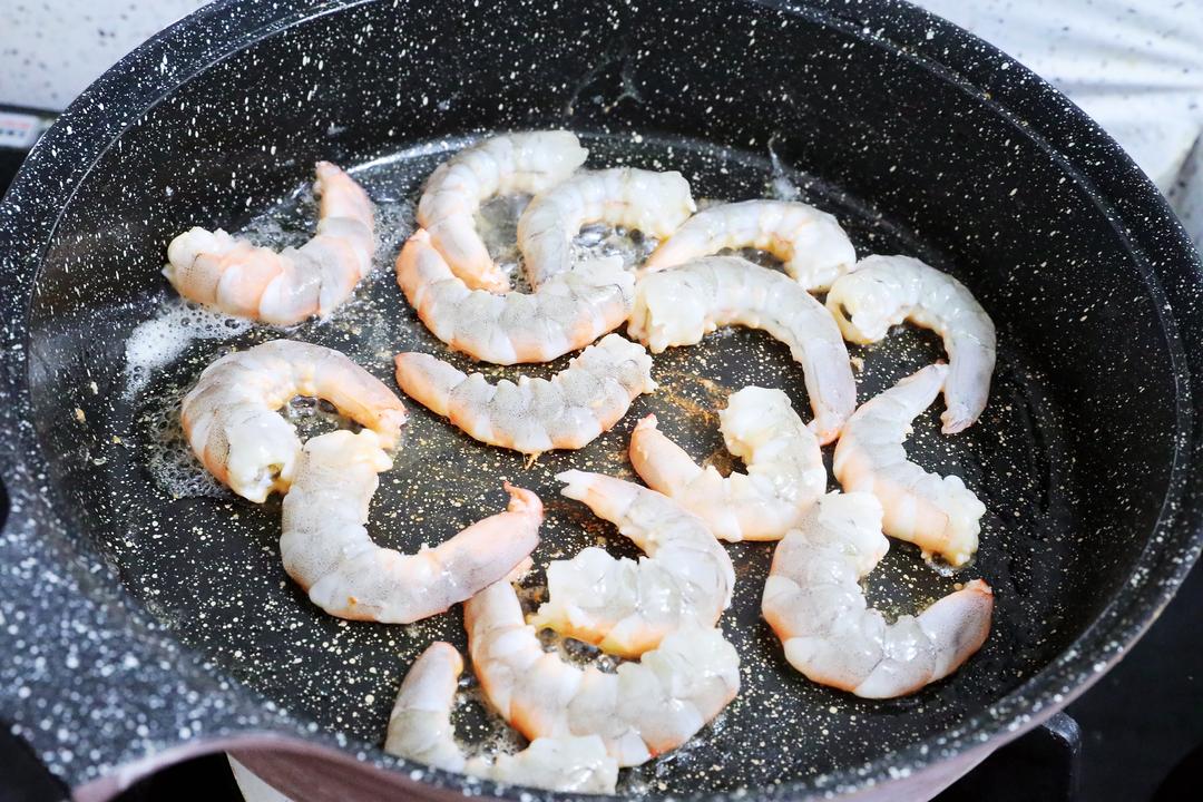 In the same pan, sear the shrimp until they c