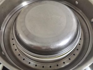 Cover with a second plate, left slightly ajar