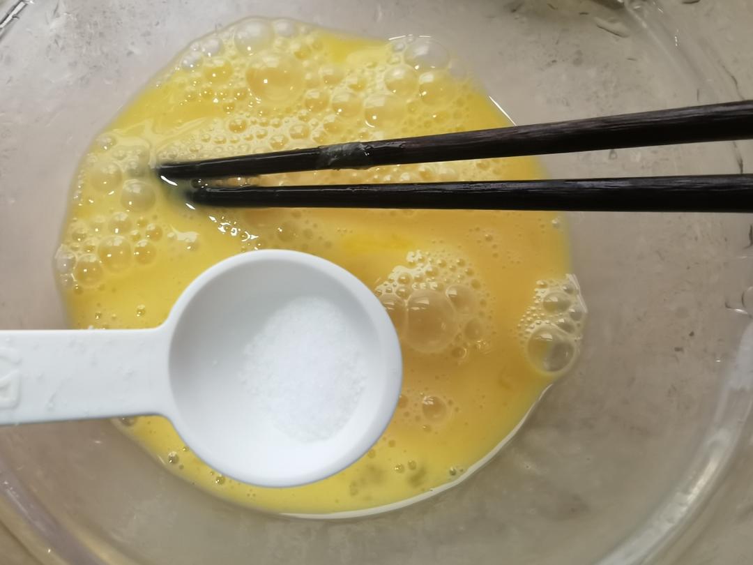Add a little salt and beat the eggs well