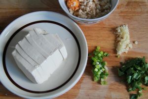 Slice the drained tofu thick