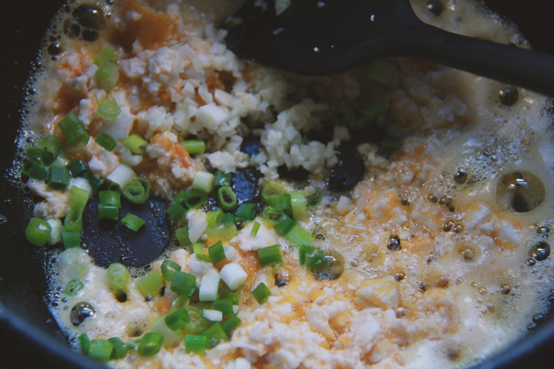 Add the chopped white, scallion, and garlic;