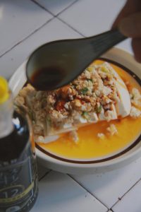 Finish with a spoon of light soy and scatter