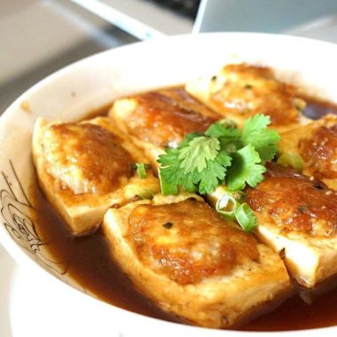 Stuffed tofu seared and glazed with pork filling
