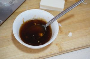 Mix the sauce: soy, oyster sauce, pepper, and