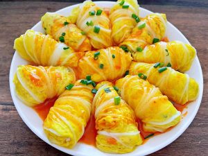 Pour the glaze over the rolls and scatter sca