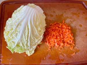 Rinse the cabbage, trim the hard stems, and d