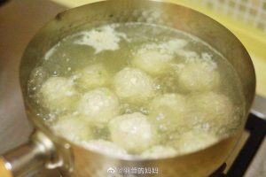 Poach the spoon-shaped meatballs