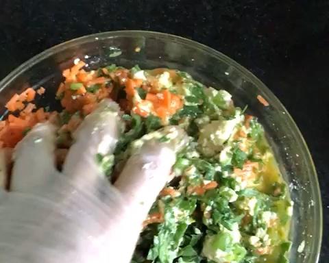 Mix the greens, tofu, and egg by hand until e