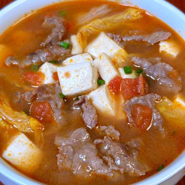 Tender beef and tofu in a sweet-sour tomato broth