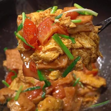 Pan-golden tofu and egg folded through a tomato sauce