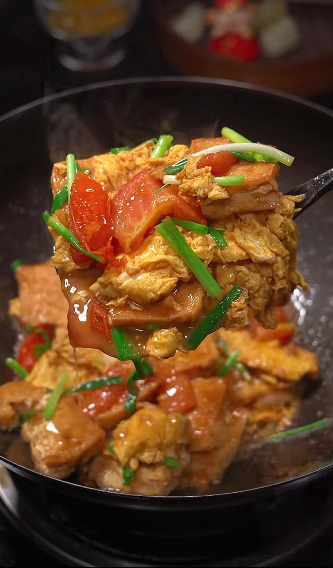 Pan-golden tofu and egg folded through a tomato sauce