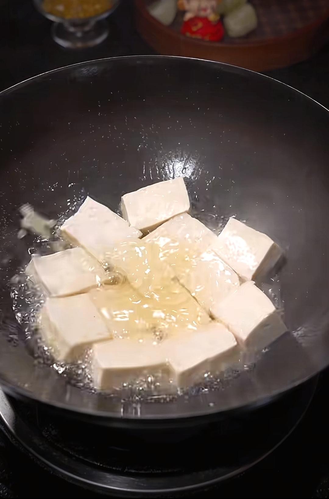 Lay in the tofu cubes one by one