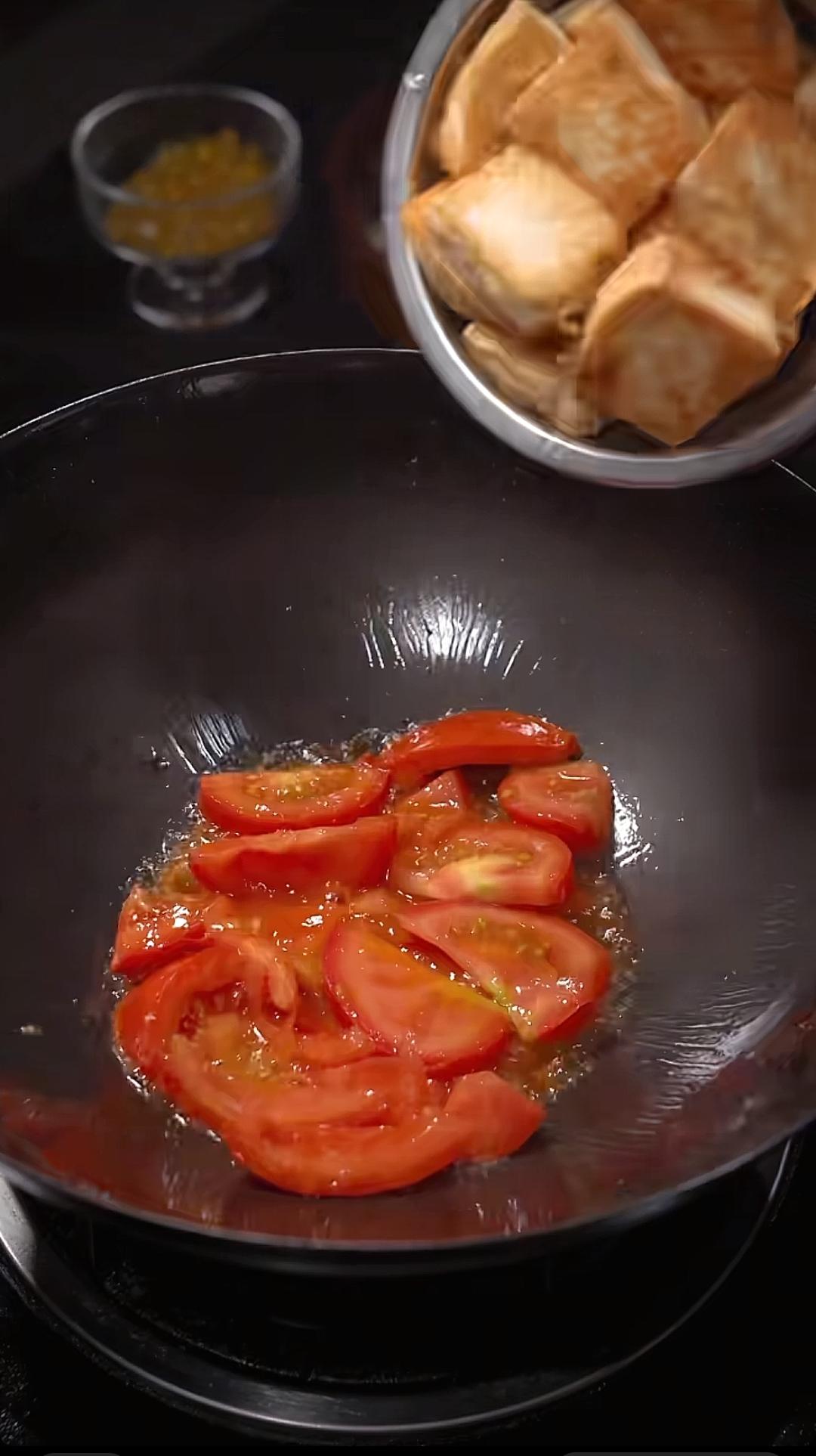 Add the tomato to the pan and cook until it r