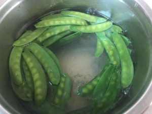 Blanch the snow peas and lift them out at onc