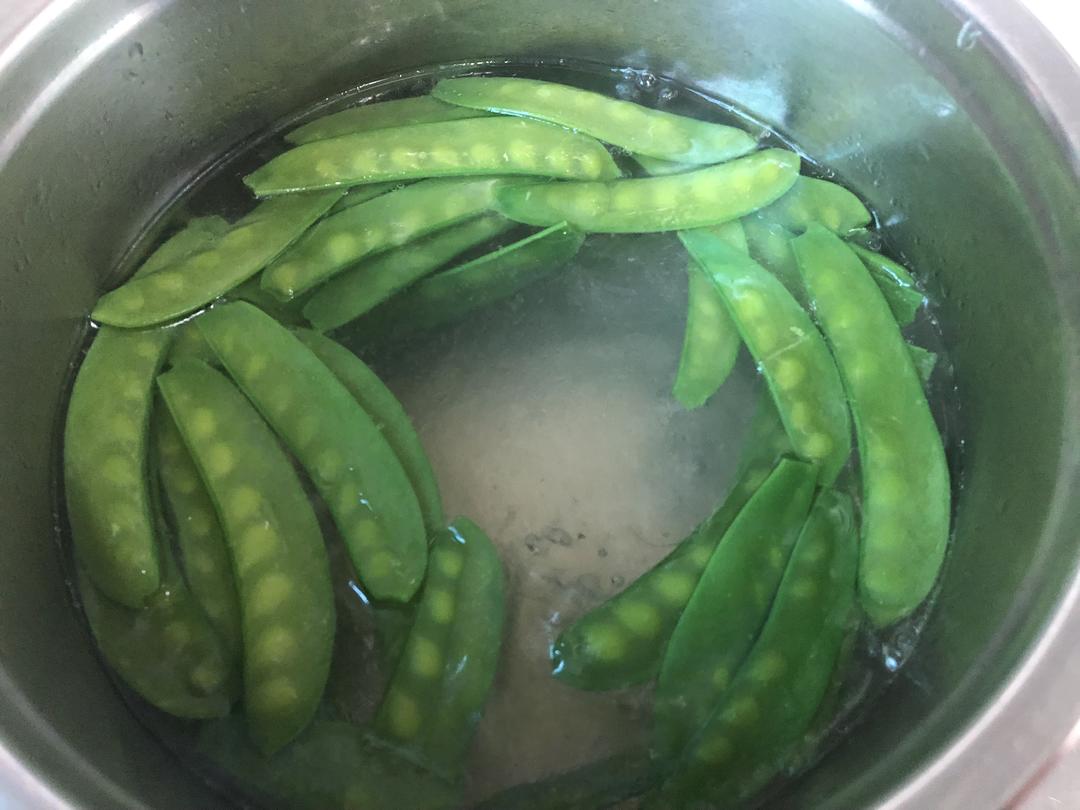 Blanch the snow peas and lift them out at onc