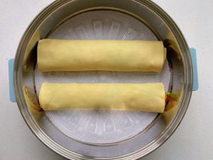 Over boiling water, steam 8-10 minutes