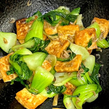 Golden tofu with seared greens and dried shrimp