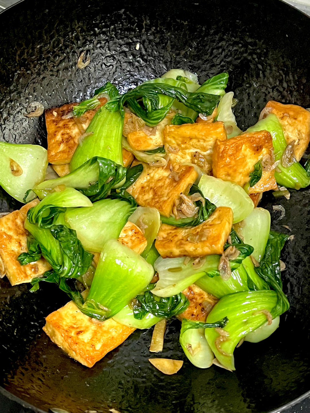 Golden tofu with seared greens and dried shrimp