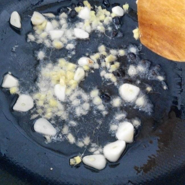 Heat oil and bloom the fermented black beans,